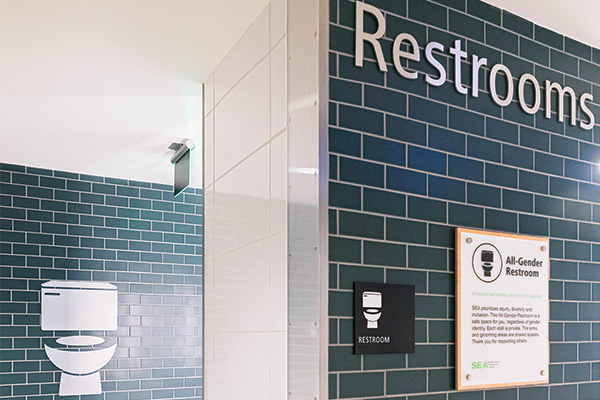 All-gender restroom entrance with toilet symbol and label