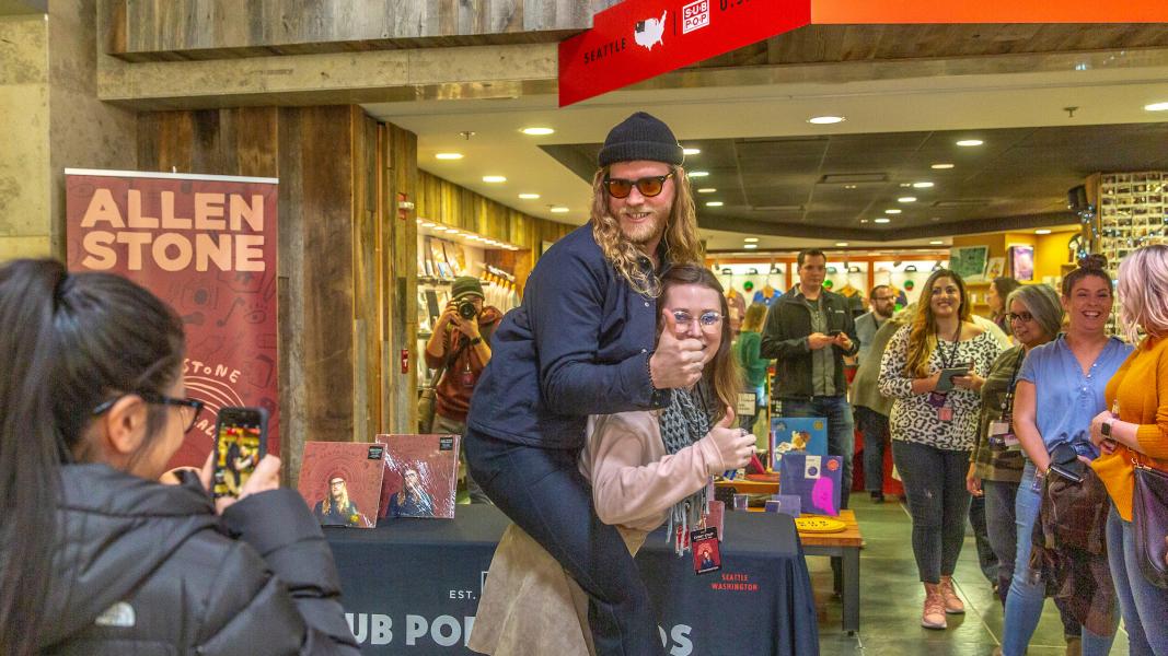 Allen Stone takes photos with fans at Sub Pop records.