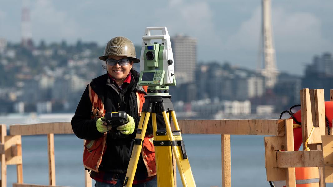 Surveyor at work on the Terminal 5 modernization project, Seattle, July 2019
