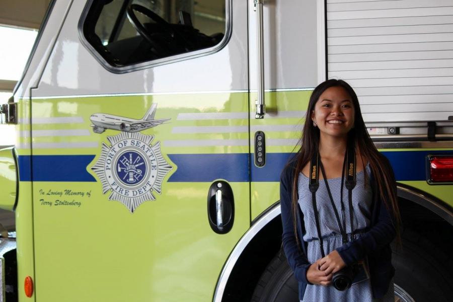 Bryanna Bui in front of a Port fire truck