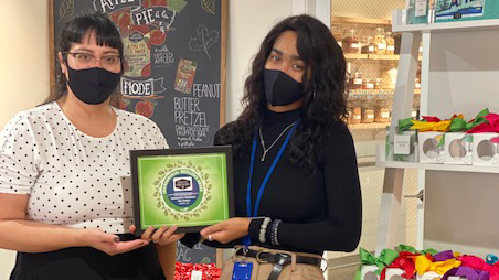 Seattle Chocolate employees receive the award at the SEA Airport shop