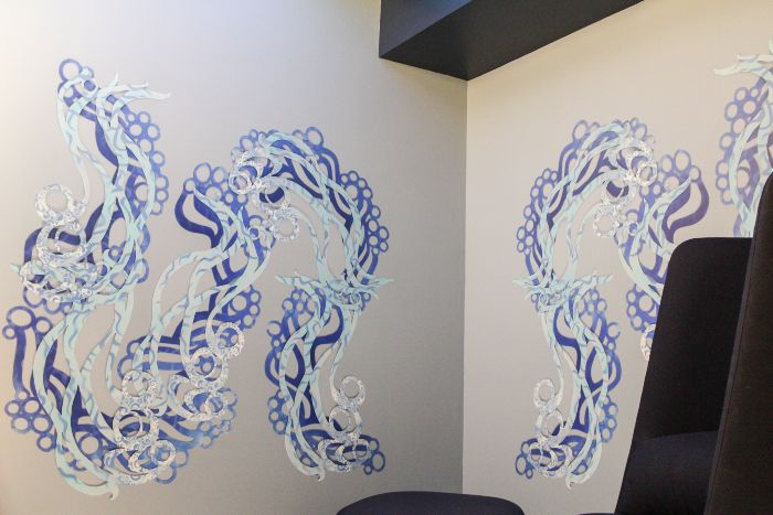 Winding blue artwork on the wall of the SEA sensory room