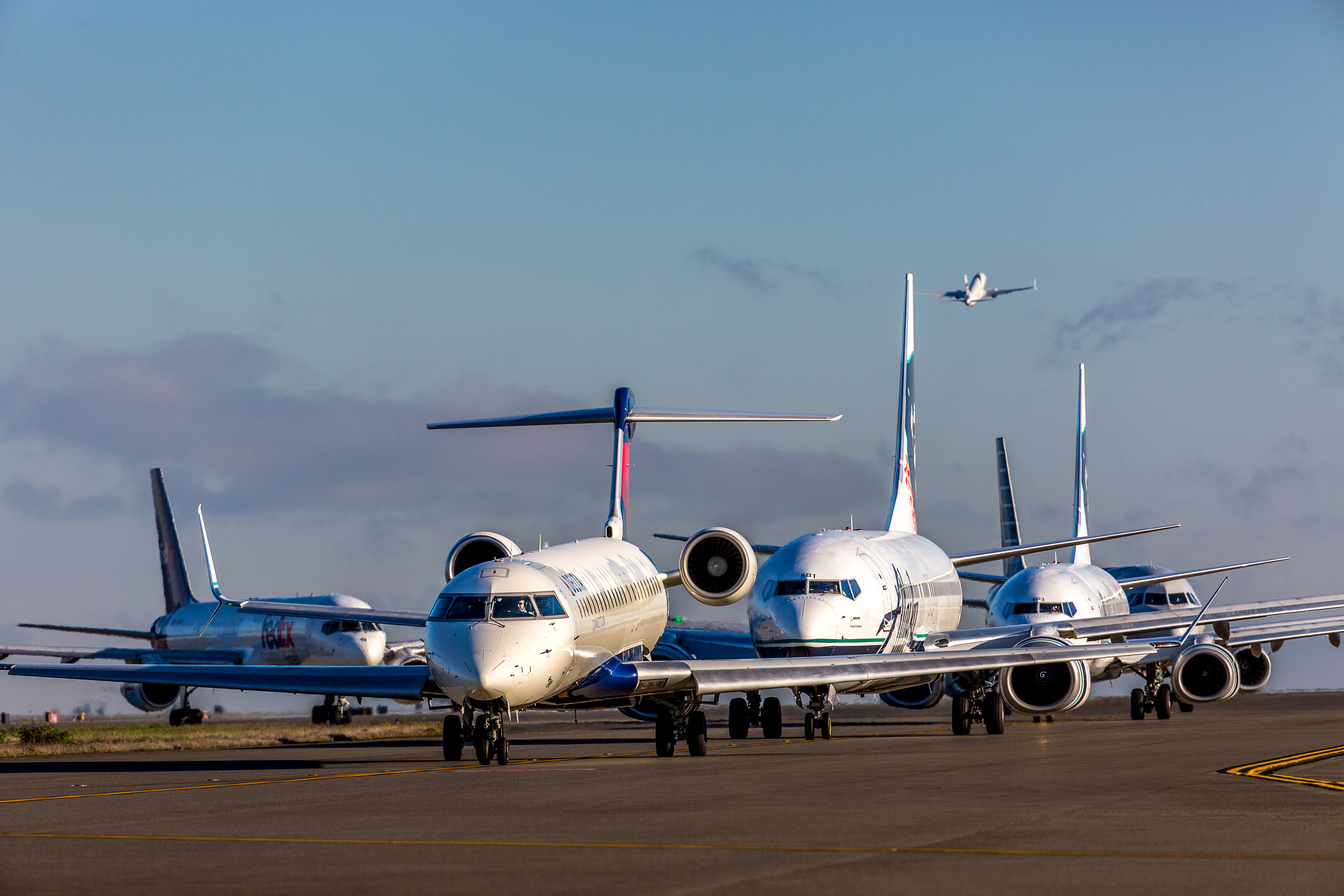 Planes at Sea-Tac Airport await on the taxiway for takeoff