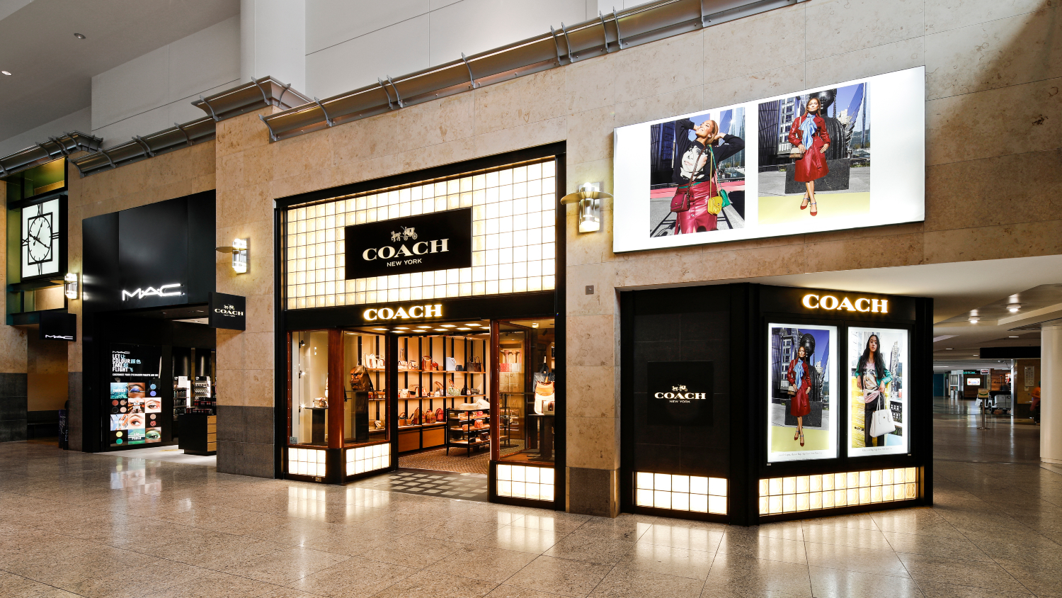 Current Coach and M.A.C storefronts in the Central Terminal at SEA Airport