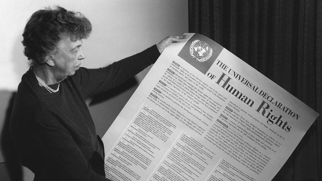Eleanor Roosevelt at the United Nations holding the Declaration of Human Rights