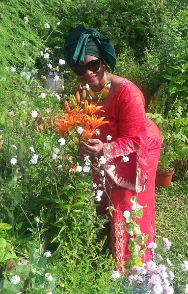 Patricia Ly in the garden with her lilies