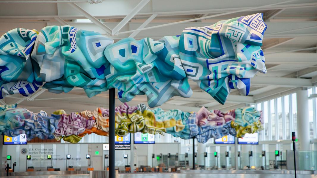 Marela Zacarías' artwork the Grand Concourse at SEA's new IAF airport reflects the colors of the water and sunset of the San Juan Islands WA