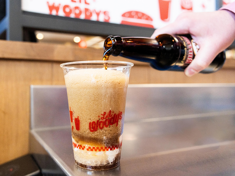 Pouring a rootbeer float at Lil Woody's.