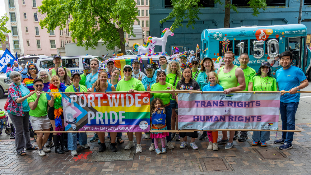 A group photo at the Seattle Pride Parade with the Port-Wide Pride Employee Resource Group and Commissioners Toshiko Grace Hasegawa, Ryan Calkins, and Sam Cho