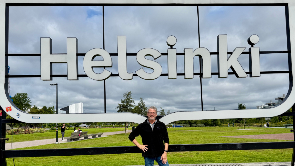Commissioner Felleman in Kansalaistori Square, in front of the Helsinki sign