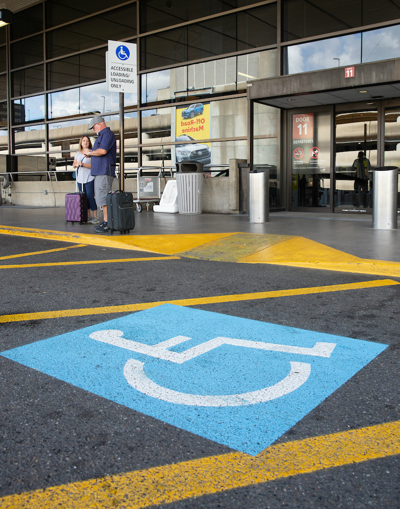 Curb cut for wheelchair access on airport drive