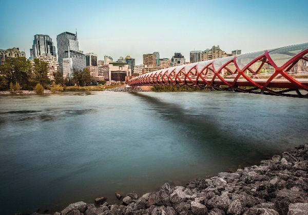 Peace Bridge and a river with Calgary skyline in the background