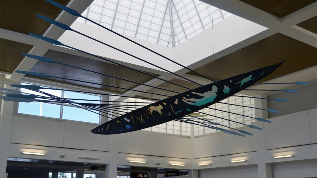 This canoe, carved by indigenous peoples of the Pacific Northwest, hangs in the D Concourse of SEA Airport