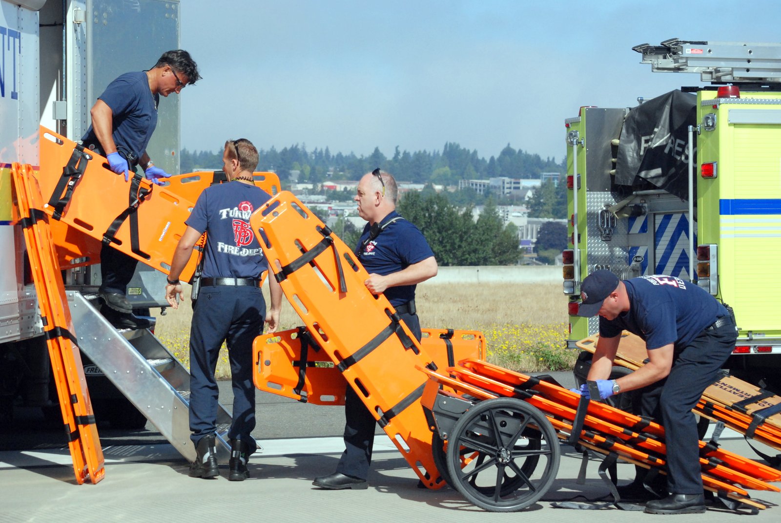 2014 Triennial Drill - Firefighters prepare backboards