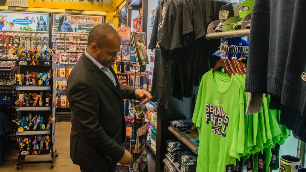 Marques Warren at Hudson News in the S Satellite, one of 18 shops at SEA operated by Warren News & Gift and the Hudson Group. 