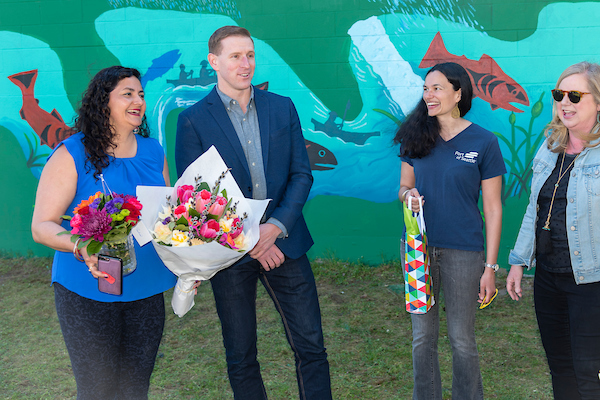 Port Commissioner Calkins talks with mural participants