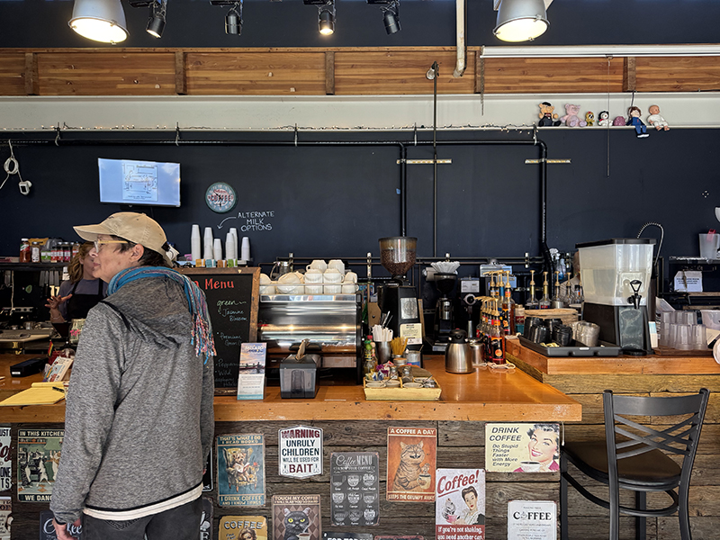 A customer orders at the counter at Jibe Cafe