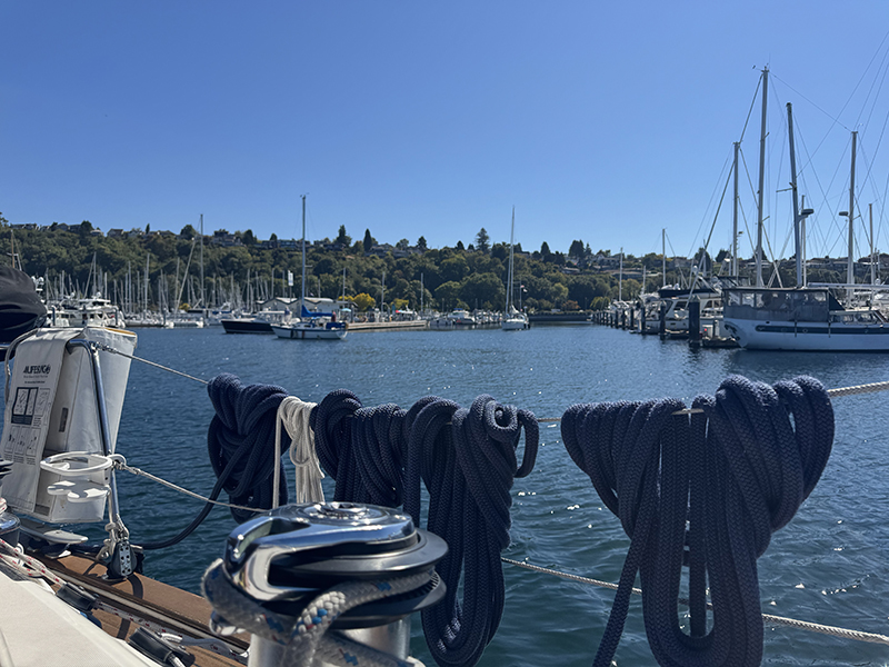 View of boats moored at Shilshole Bay marina from a sail boat charter.