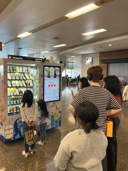 People using the Kawaii Treats vending machine