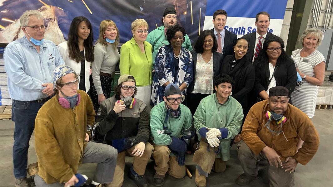 Commissioner Mohamed and Congressional delegation with students at the Harbor Island Training Center