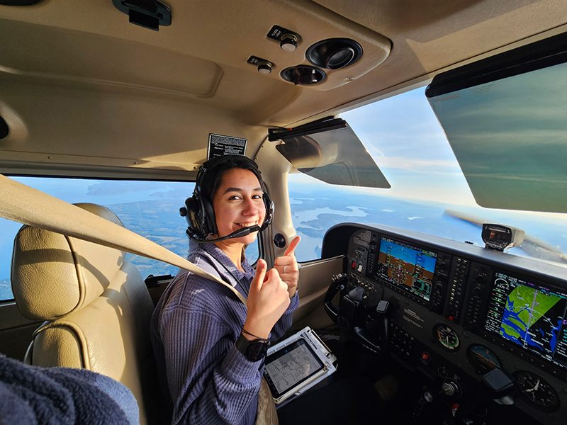 Cilicia Diaz flying an airplane.