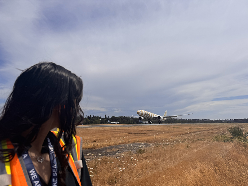Cilicia Diaz watches planes take off at SEA.