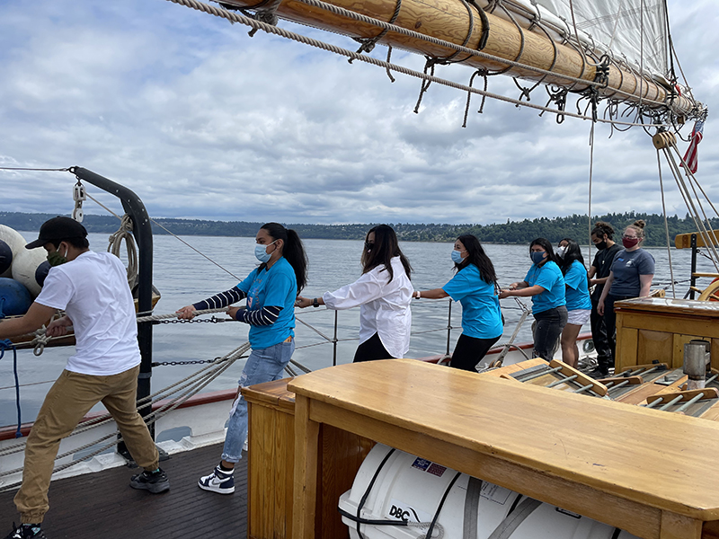 YMAP participants on deck of a tall ship