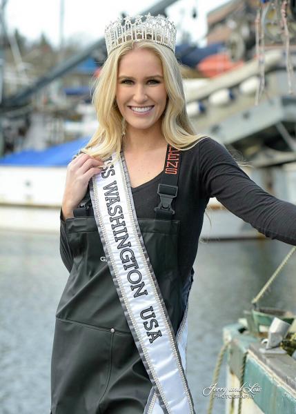 Evelyn Clark in fishing gear with crown on and Miss Washington USA sash on