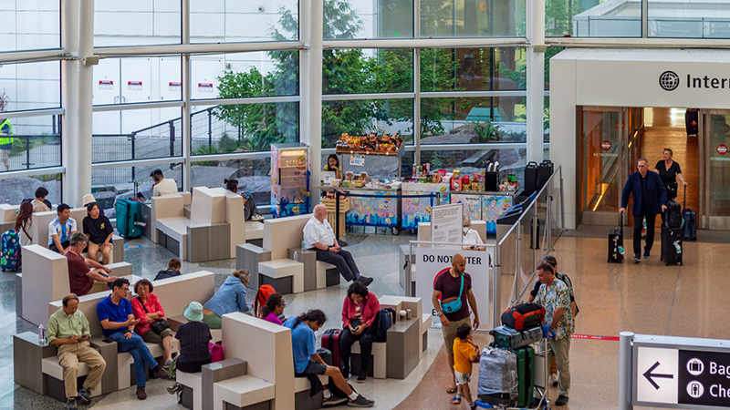 Travelers sitting in Gina Marie Lindsey Hall