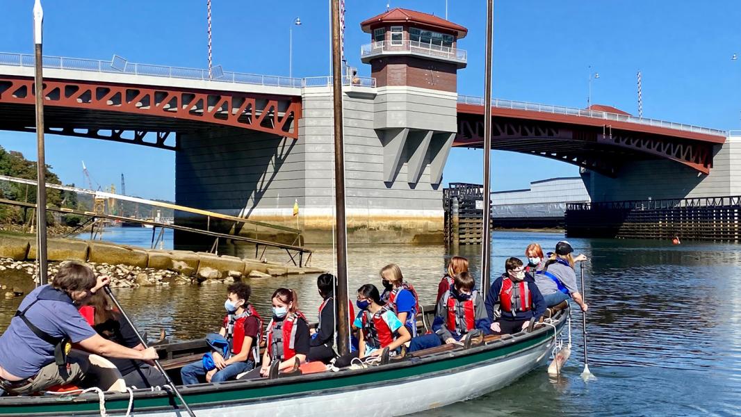 Students from the Maritime High School tour the Duwamish River on a boat on a sunny day in September 2021