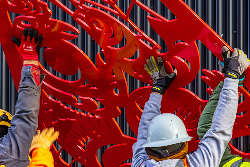 Close up of "Beach Seining" being installed at the Maritime Innovation Center.