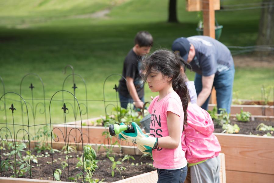 Kids work in Midway Park Community Garden.
