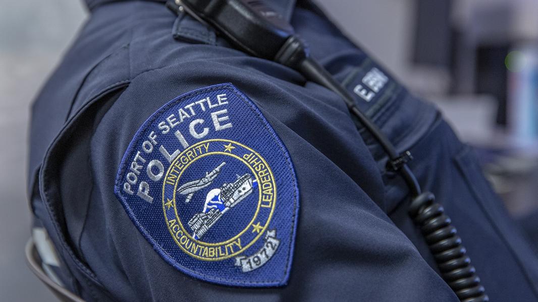 Port of Seattle Police badge on the arm of a uniformed officer