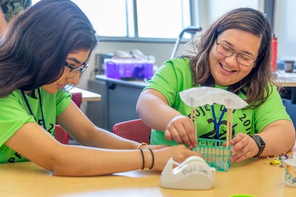 Students building a parachute