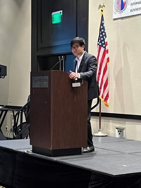 Commissioner Cho speaking to the crowd at the conference.