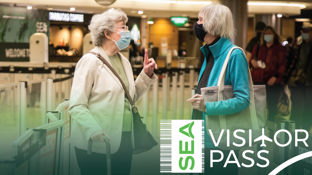 Passengers in masks with the SEA Visitor Pass logo