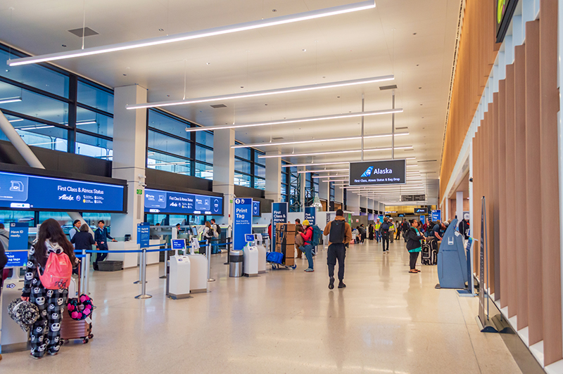 Travelers make their way through Alaska Airlines' new check-in area as part of the SEA Gateway project.