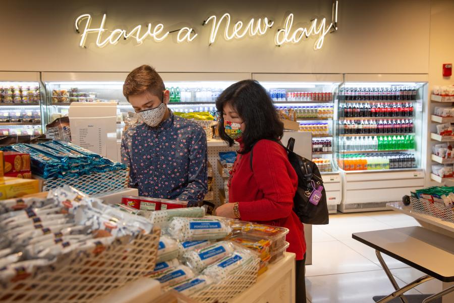 Travelers picking up snacks at the airport