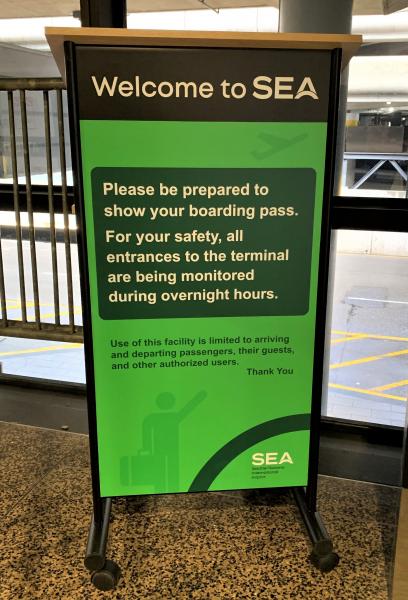 Signage about overnight entry to the airport