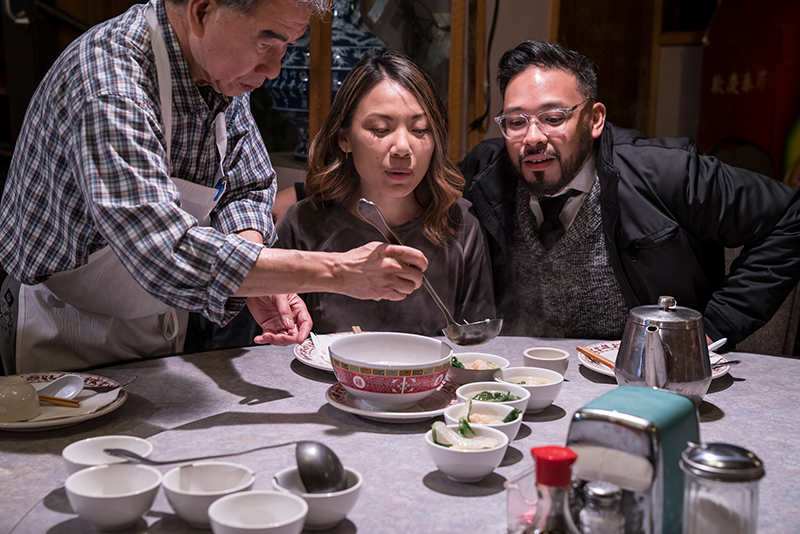 Ladeling soup on a Wing Luke Food Tour