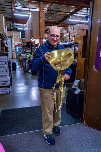 Andy Carrol with the damaged tuba TW Carrol helped replace.