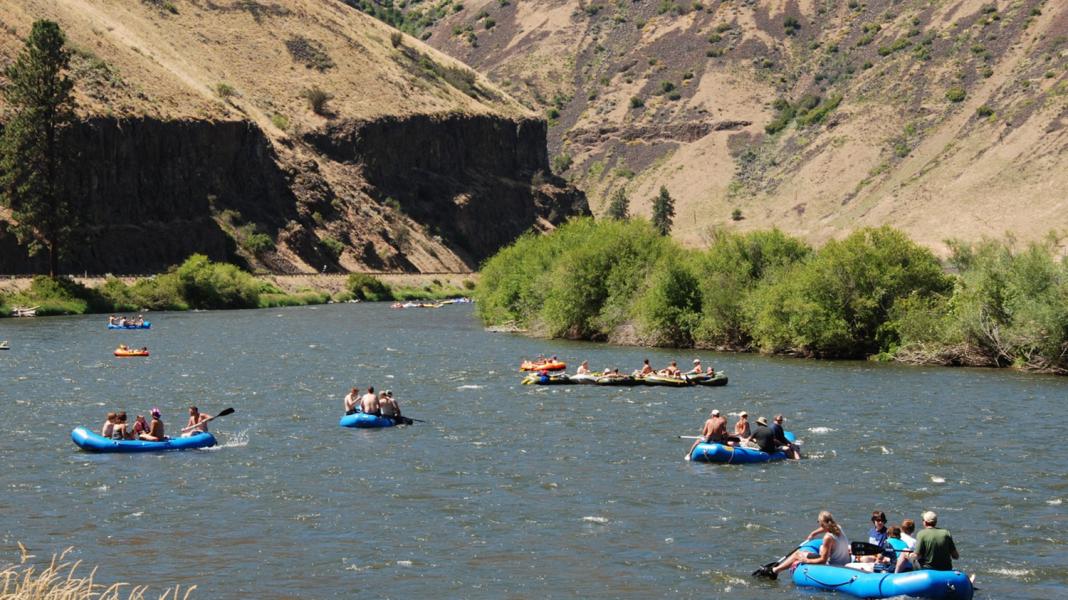 River rafters float down the Wenatchee River in Chelan County