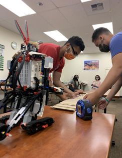 Students working with a robot