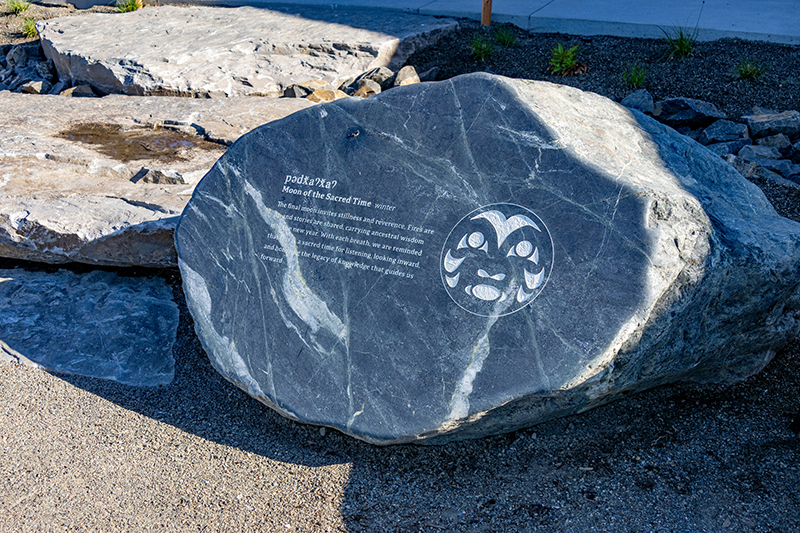 A stone depicting the Moon of the Sacred Time.