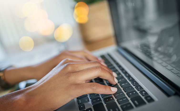 Hands typing on keyboard
