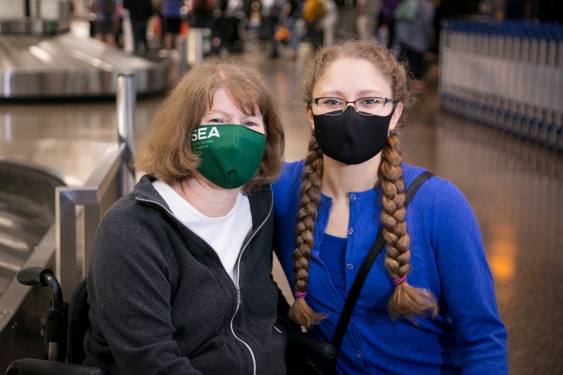 Two women wearing masks at SEA Airport