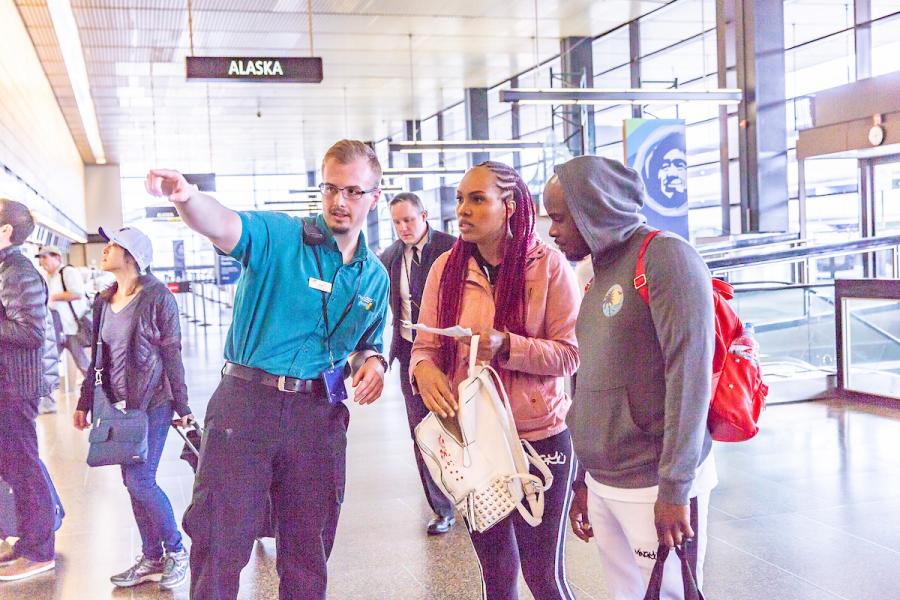 Pathfinders help direct passengers at the airport