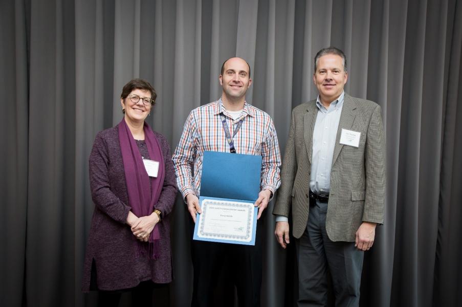 Perry Welch is recognized by Maritime Managing Director Stephanie Jones Stebbins and Chief Financial Officer Dan Thomas. Not pictured: Ellen Fisher.