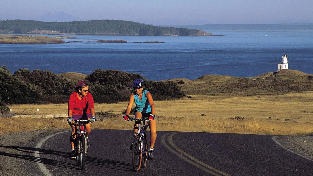Two women bicycle on Whidbey Island