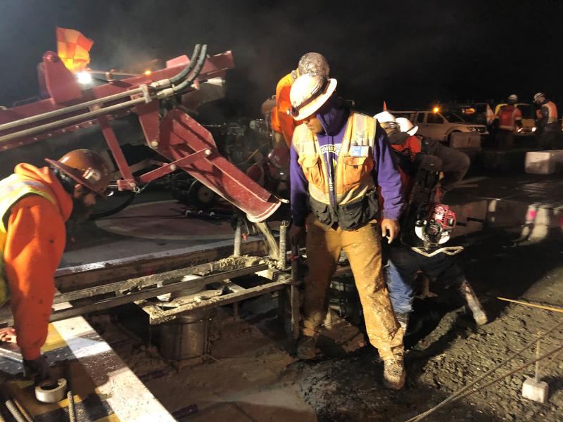 Construction workers constructing concrete at the airport